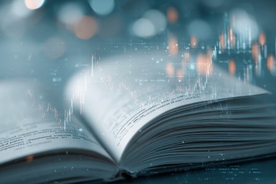 翻开的书与金融数据光影画面 翻开的书与金融数据光影画面