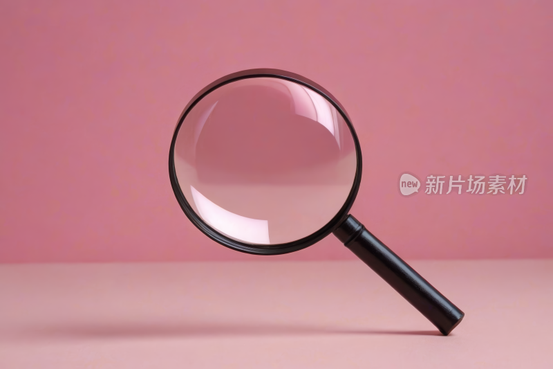 桌子上放大镜特写高清图片