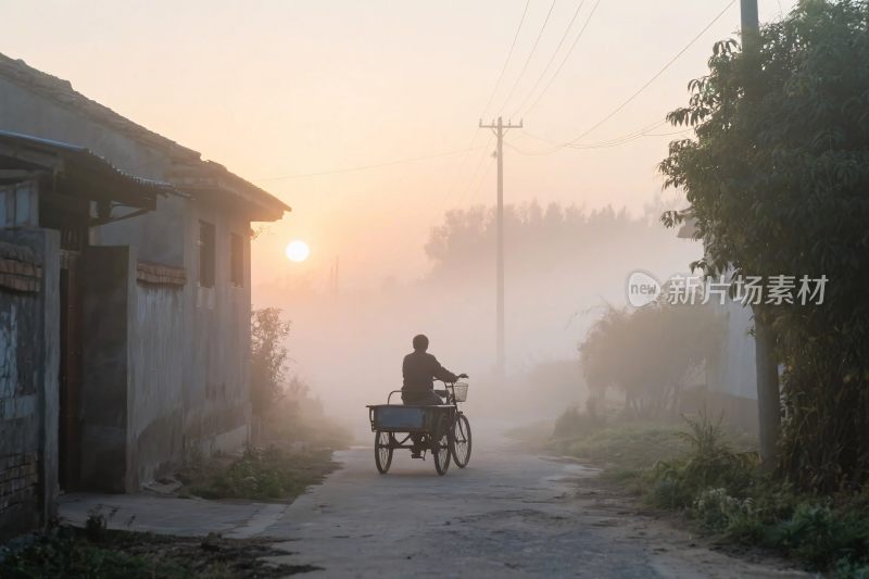 晨曦中乡间推车的身影