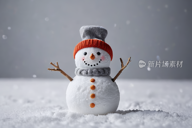 一个雪人站在雪地里高清图片