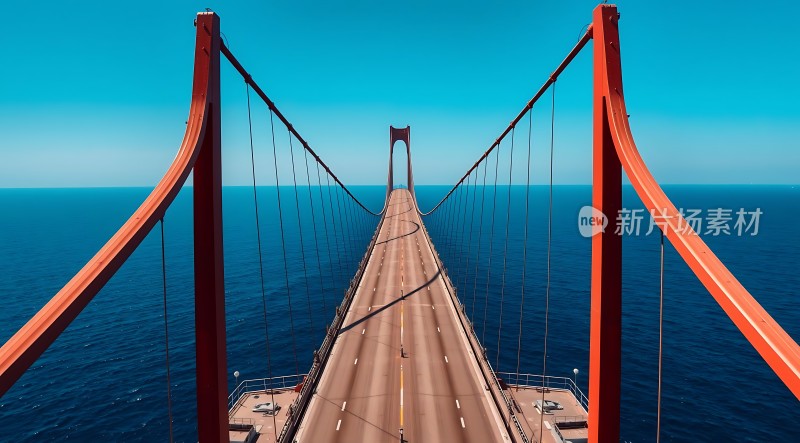 红色悬索桥横跨蔚蓝海洋
