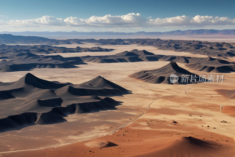 掠夺沙漠景观有几座山丘和一条道路风景图片