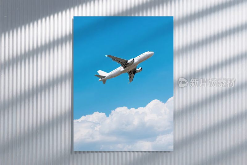 蓝天白云下飞行的飞机