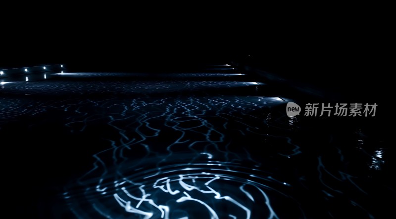 黑暗中光影交织的水面波纹