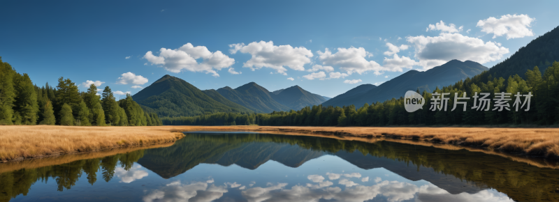 田野中央一个小湖山脉高清风景横幅图片