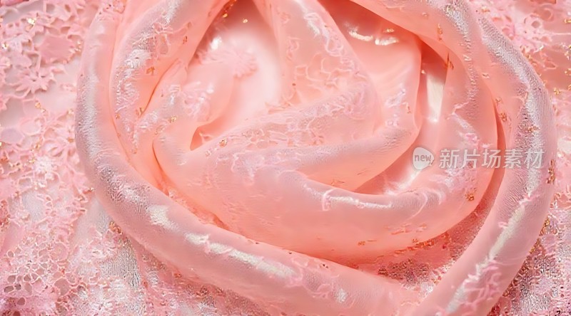 粉色蕾丝面料特写展现细腻纹理与光泽感