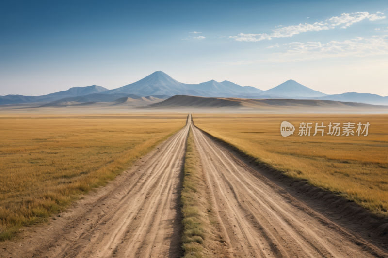 土路位于广阔的平原中央有山脉高清风景图片