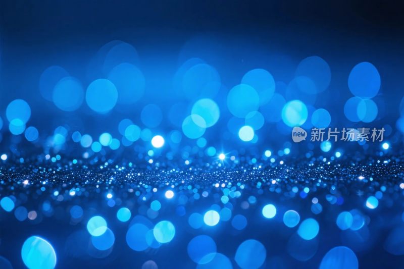 蓝色光斑粒子背景