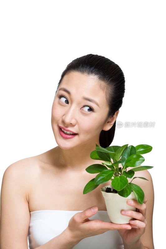 棚拍年轻女人和绿色植物