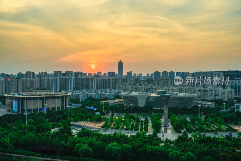 航拍夏季日落时段郑州图书馆晚霞风光