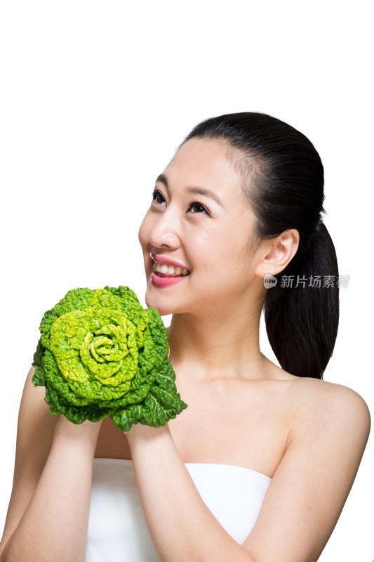 棚拍年轻女人和绿色蔬菜