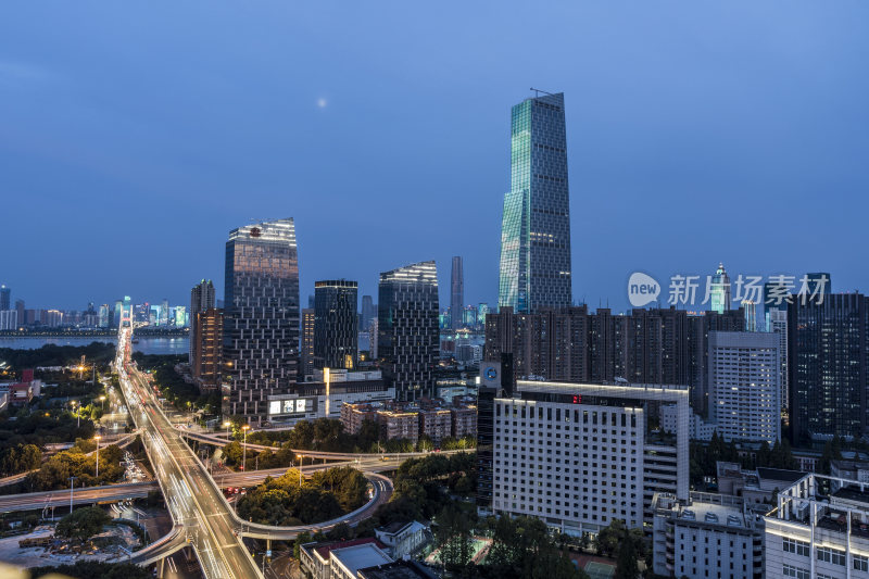 城市夜景下的繁华高楼与交错立交桥