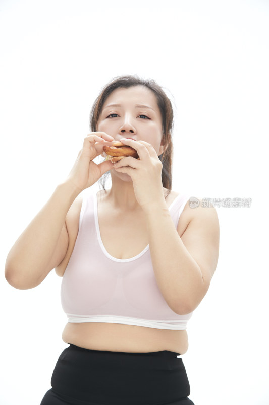 因暴饮暴食导致身材走样的亚洲女士