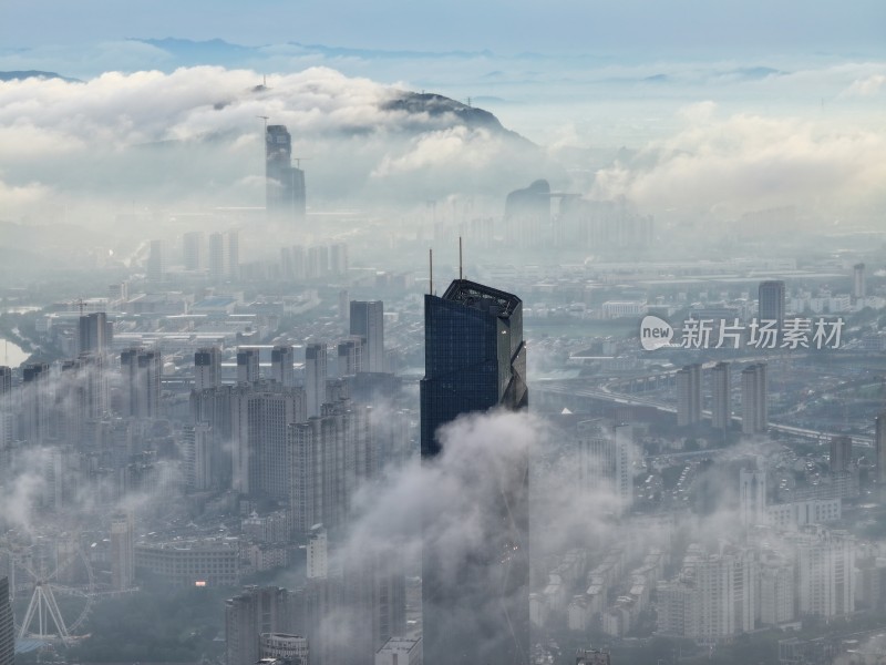 浙江湖州地标云雾缭绕的城市高空鸟瞰全景