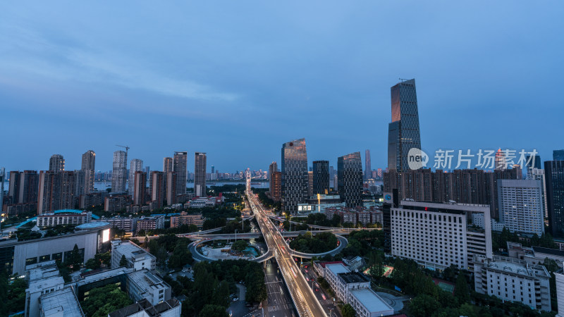 城市夜景下的繁华高楼与交错立交桥