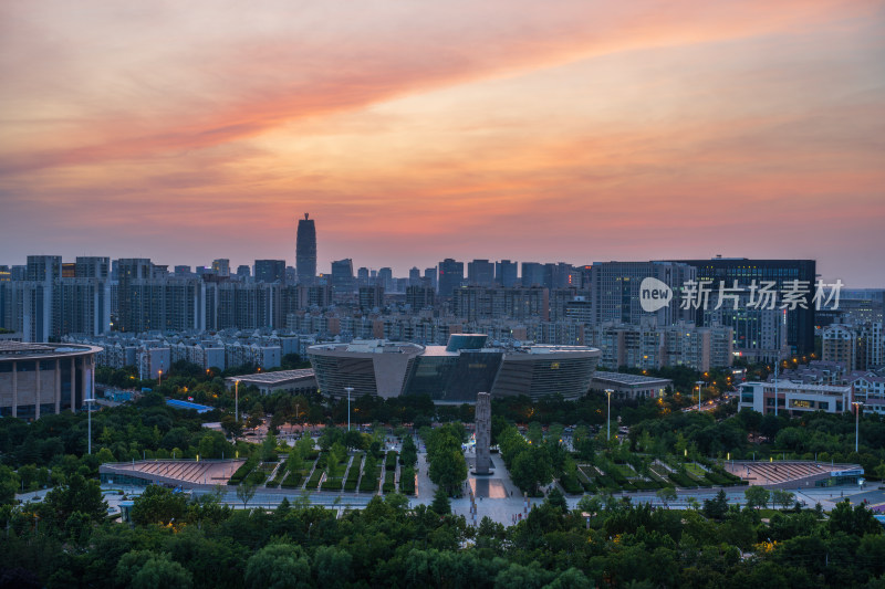 航拍夏季日落时段郑州图书馆晚霞风光