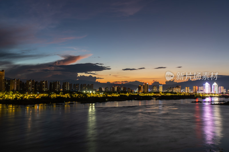 夕阳下的西双版纳景洪市城市剪影