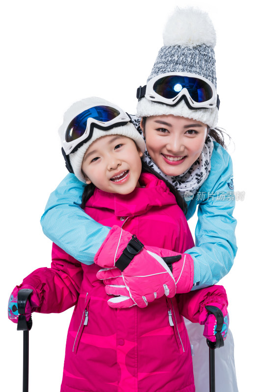 年轻妈妈和女儿滑雪