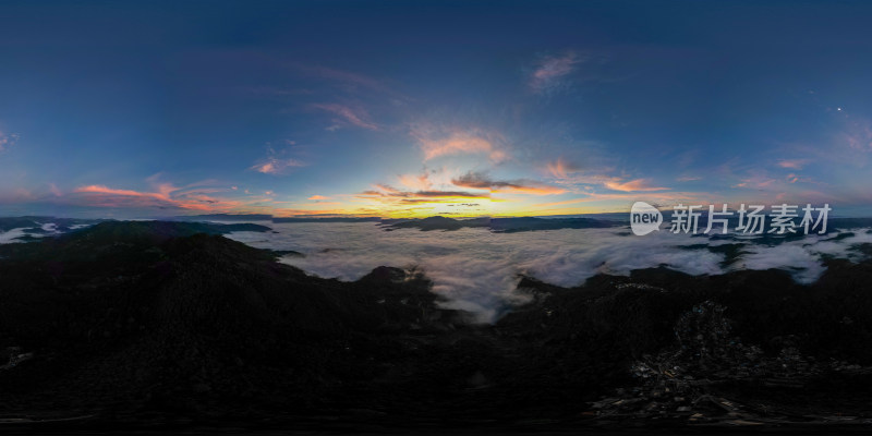 航拍云海之上群山环绕的日出全景