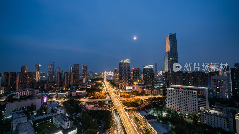 城市夜景下的繁华高楼与交错立交桥