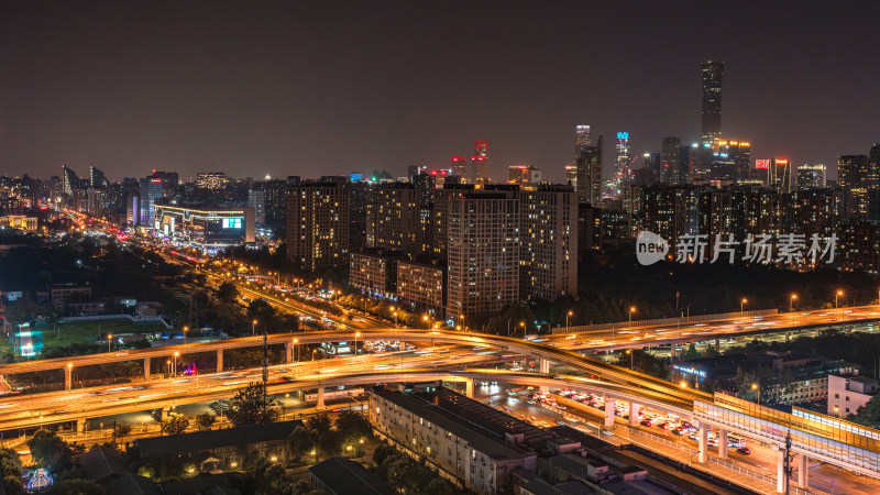 北京城市夜景下的立交桥及周边建筑灯光