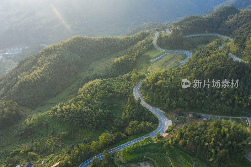 航拍穿过梯田盘旋弯曲的公路