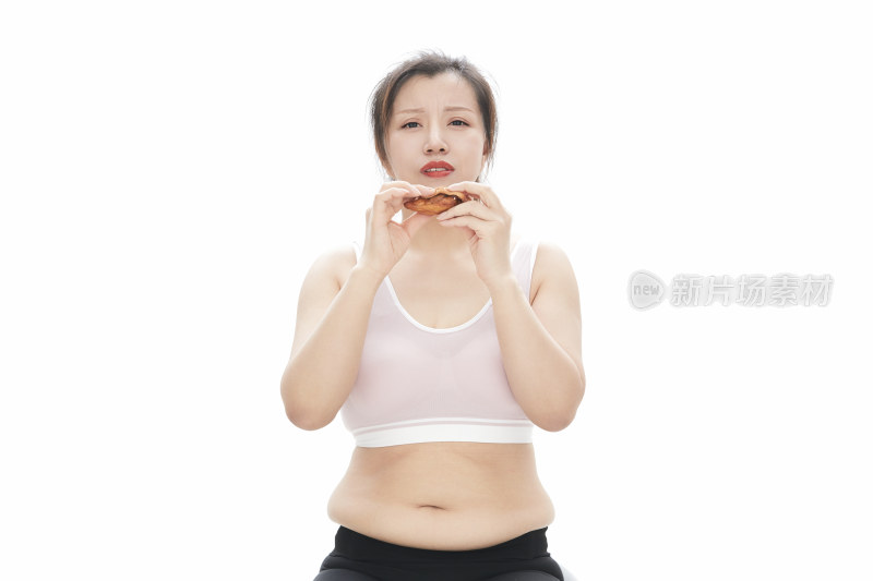 因暴饮暴食导致身材走样的亚洲女士