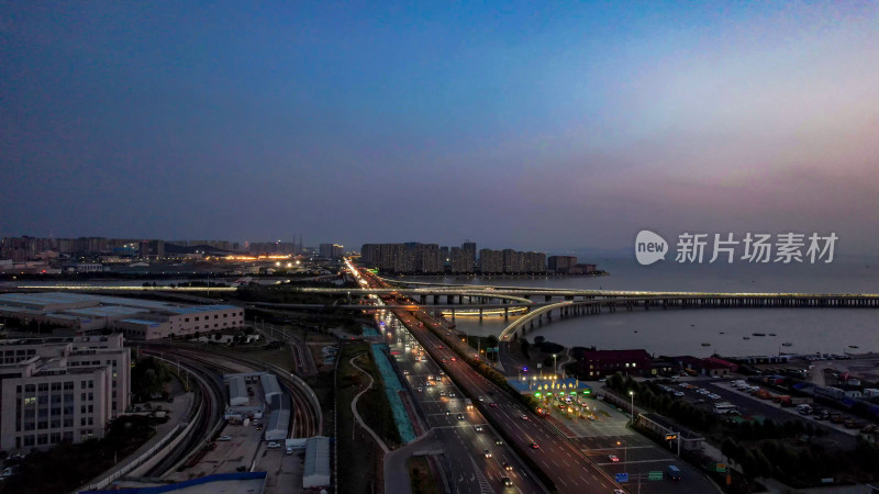 山东青岛城市夜幕降临夜景交通航拍图