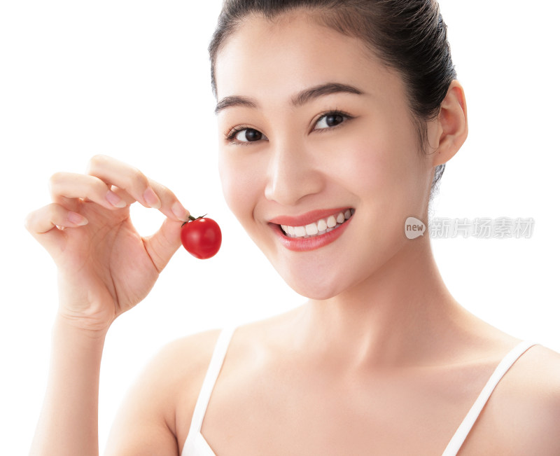青年女人吃西红柿