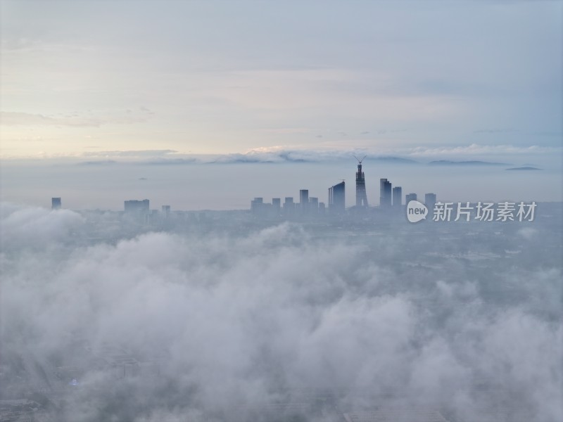 浙江湖州地标云雾缭绕的城市高空鸟瞰全景