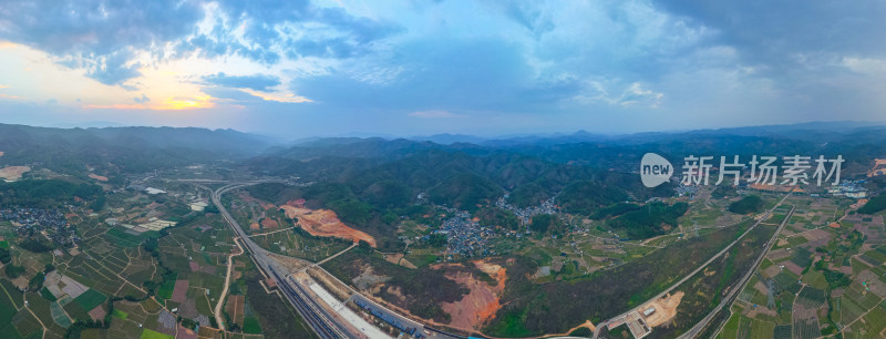 航拍山峦公路货运站全景图