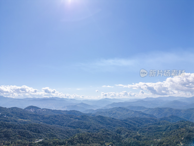 航拍蓝天白云下的景迈山山脉自然风光