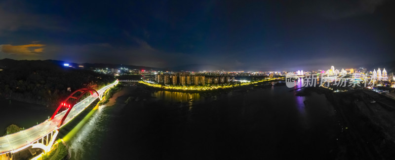 航拍西双版纳景洪市城市夜景全景图