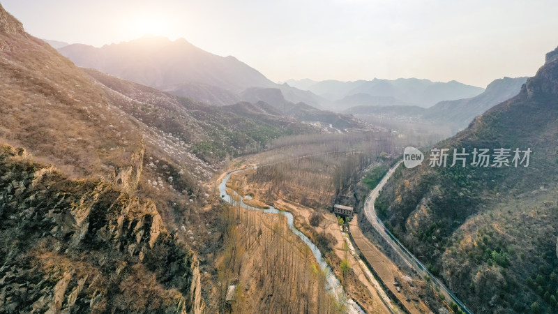 航拍北京春天山区蜿蜒的公路