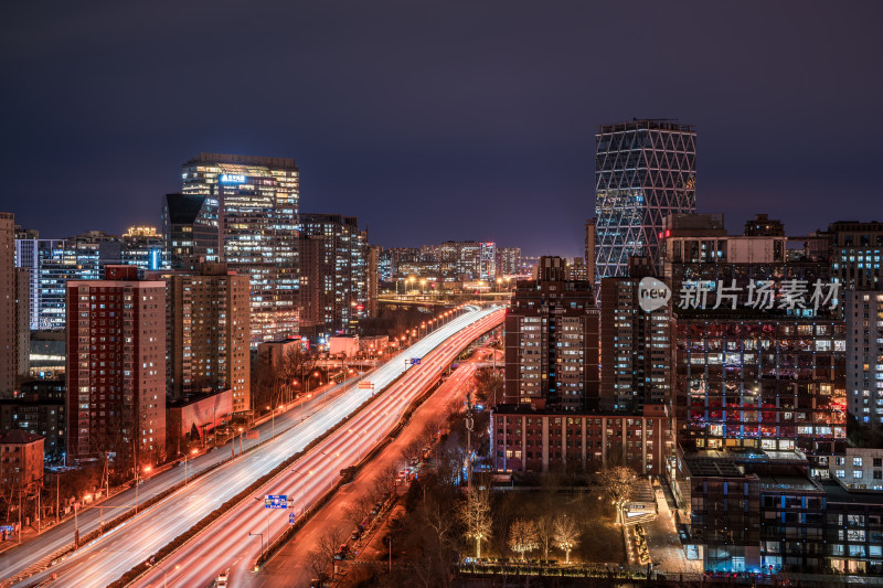 北京夜景下流光溢彩的城市道路及高楼