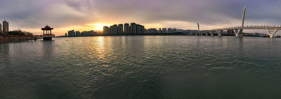 城市清晨日出朝霞河水楼房经济古建亭子风景