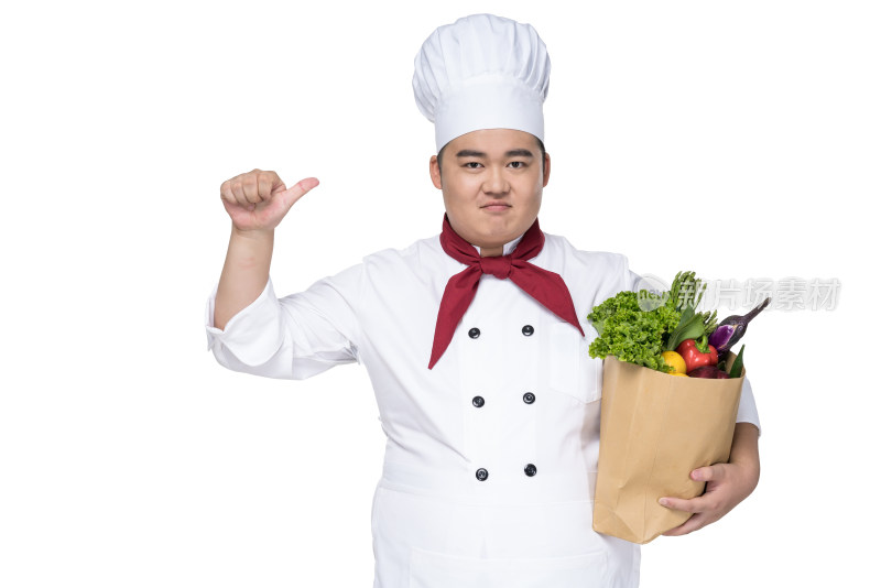 肥胖的厨师抱着一包蔬菜