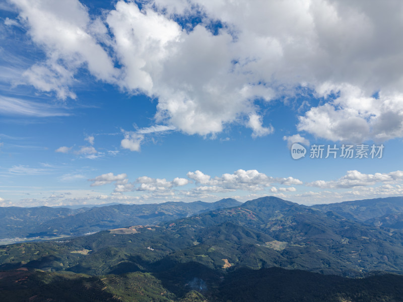 航拍蓝天白云下的景迈山山脉自然风光