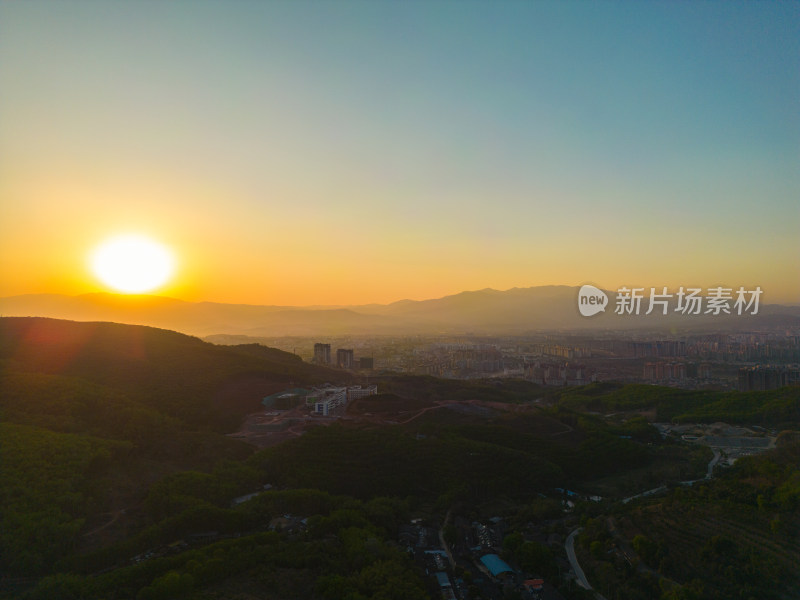 航拍日落山峦西双版纳城市全景