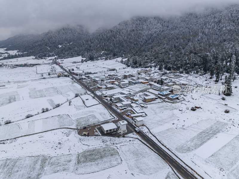 西藏林芝地区鲁朗小镇雪景高空航拍