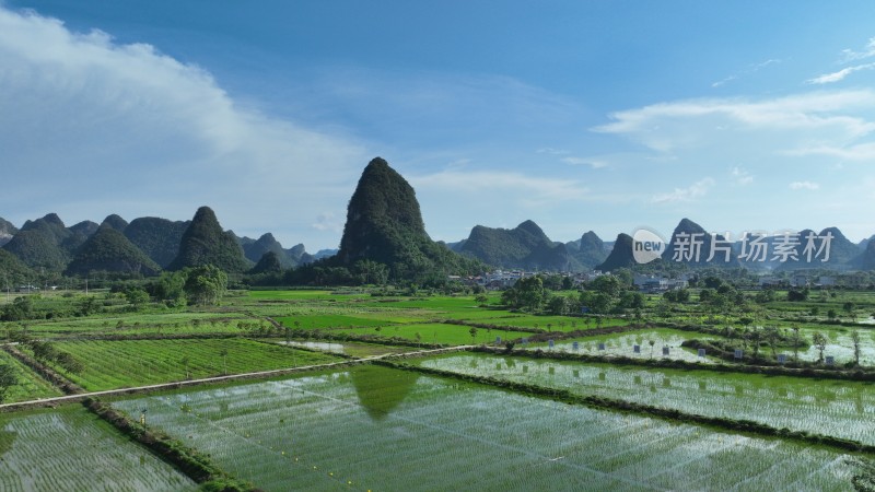 航拍广西柳州奇峰山脉喀斯特地貌山峰稻田