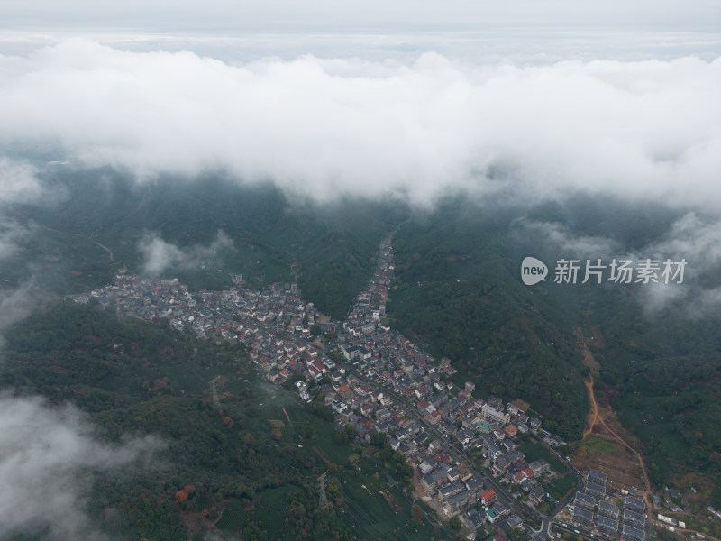 航拍俯拍白云云海下的乡村