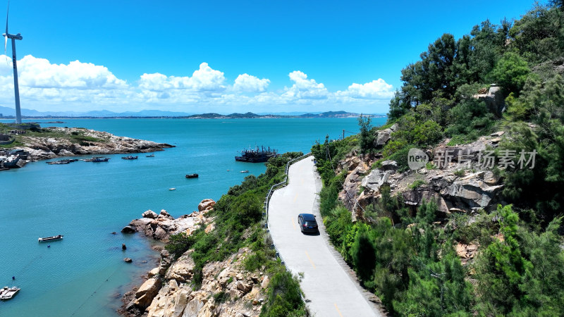 汽车行驶在海边公路航拍风景旅拍旅行自驾游