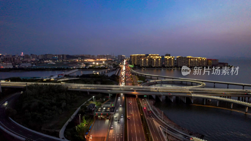 山东青岛城市夜幕降临夜景交通航拍图