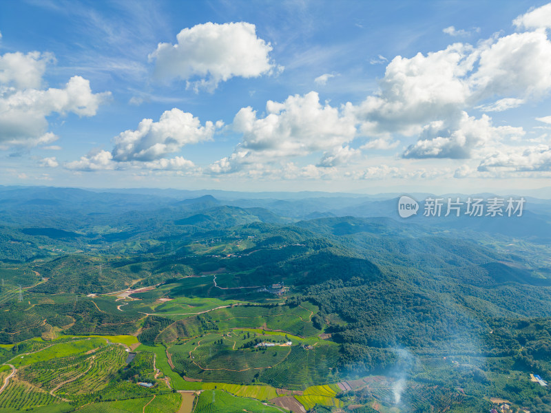 航拍天空高山草甸山脉田园村寨风光