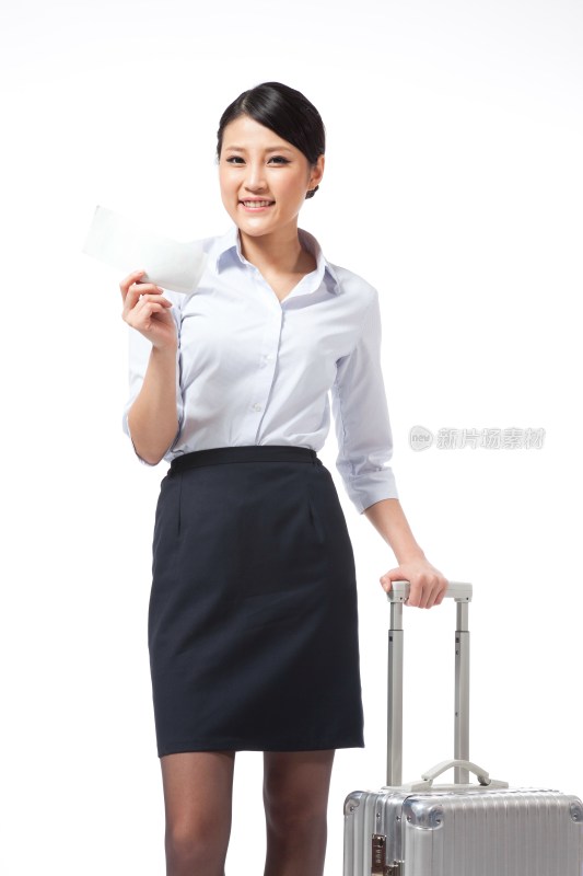 棚拍年轻商务女士拉着旅行箱拿着机票