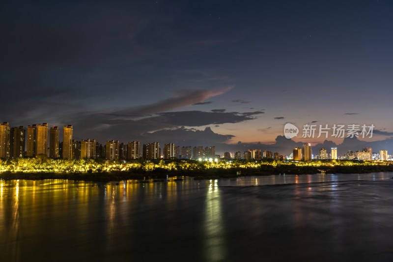 夕阳下的西双版纳景洪市城市剪影