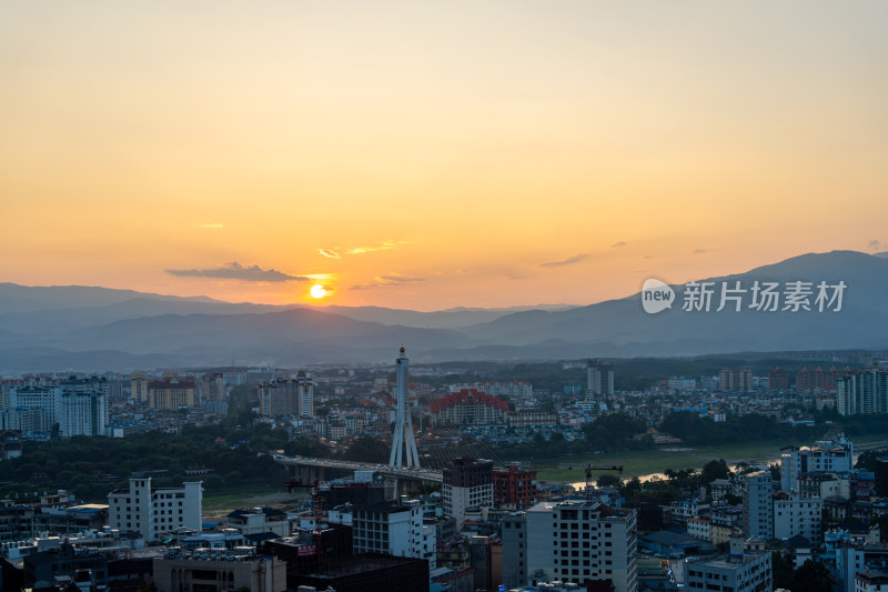 夕阳下西双版纳城市桥梁与建筑景观