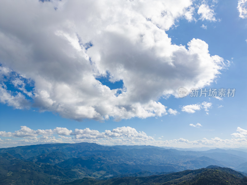 航拍蓝天白云下的景迈山山脉自然风光