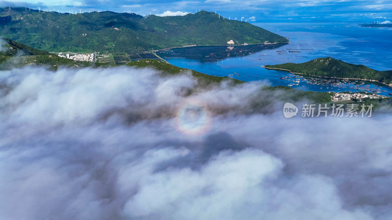 海上岛屿云海佛光美景航拍图